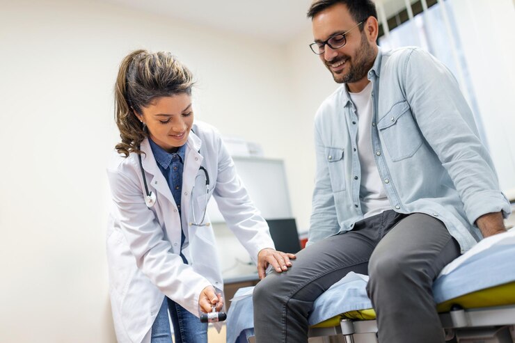 neurologist-testing-knee-reflex-male-patient-using-hammer-neurological-physical-examination-selective-focus-close-up